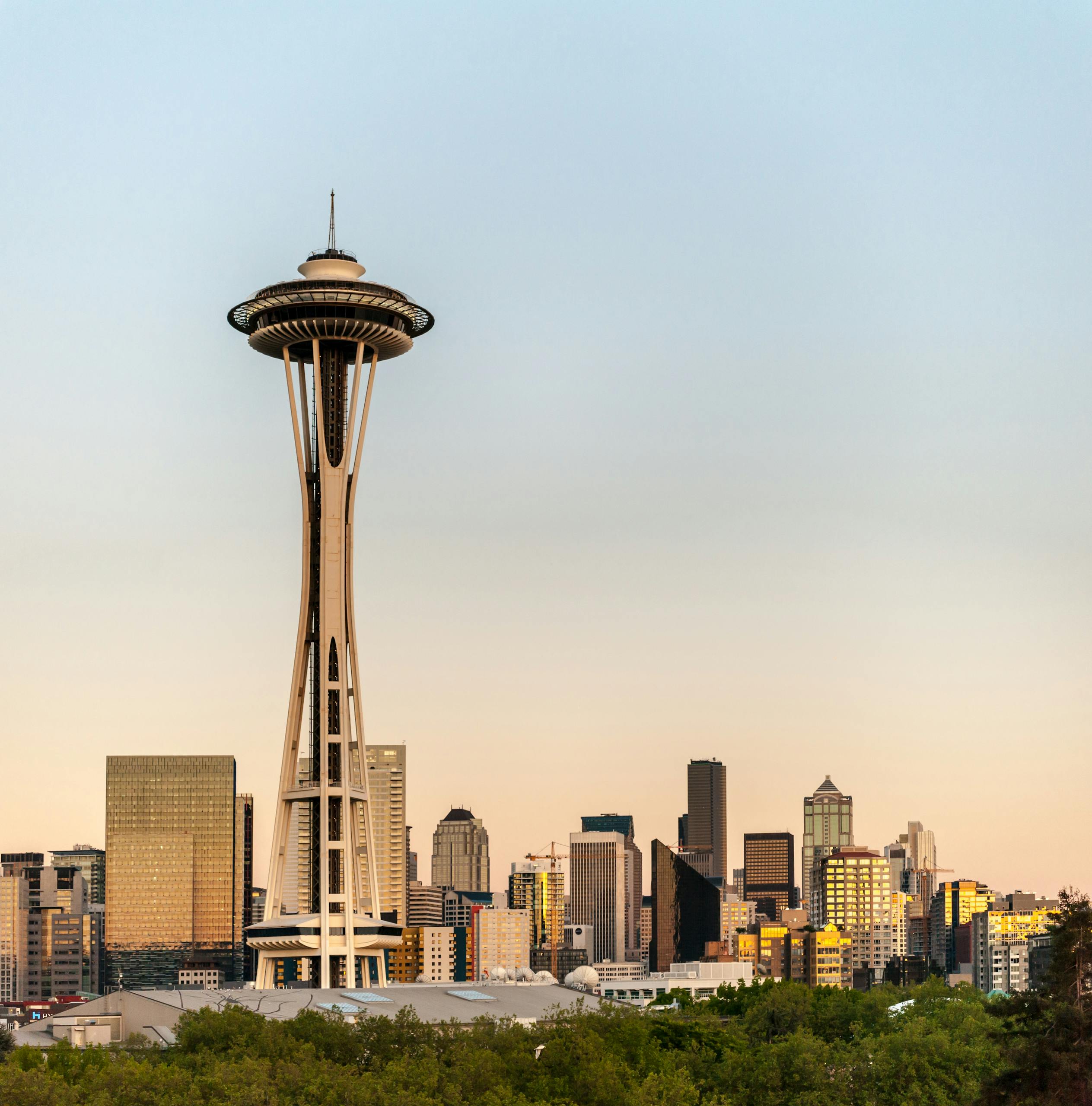 Skyline view of Seattle with the iconic Space Needle at sunset.